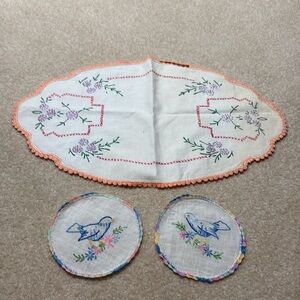 Embroidered doily and 2 round embroidered blue birds.